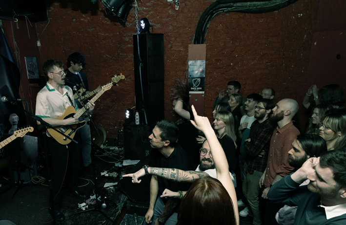 The Slugs performing in front of a crowd at a live show